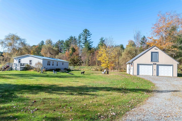 view of yard with an outdoor structure and a garage