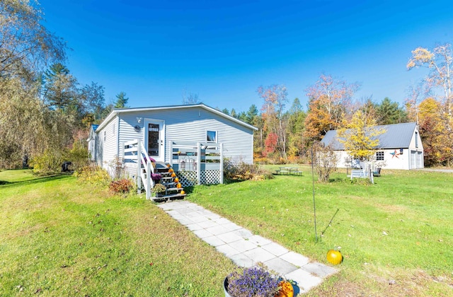 exterior space featuring a deck and a lawn