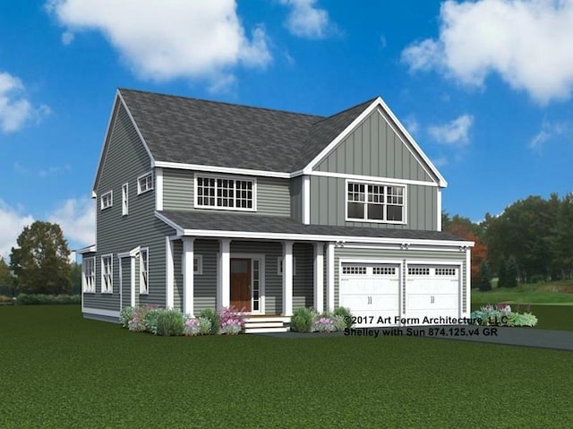 view of front of home with a garage and a front yard