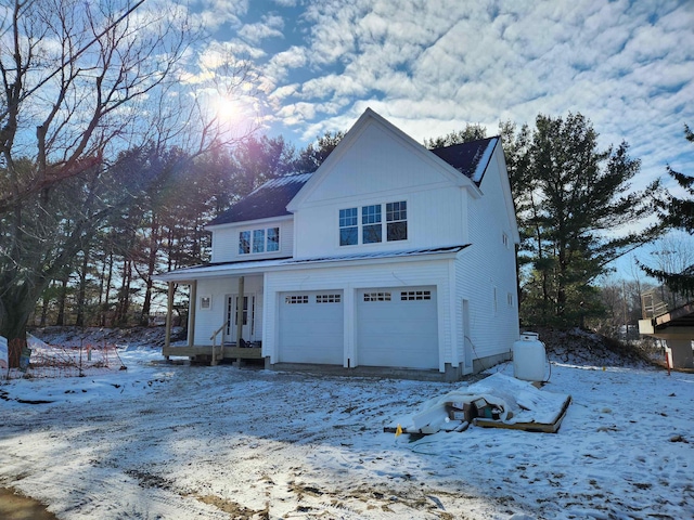 exterior space with a garage and a porch