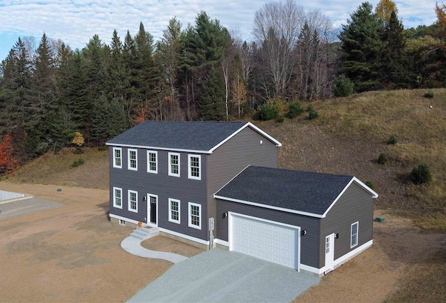 colonial inspired home with a garage