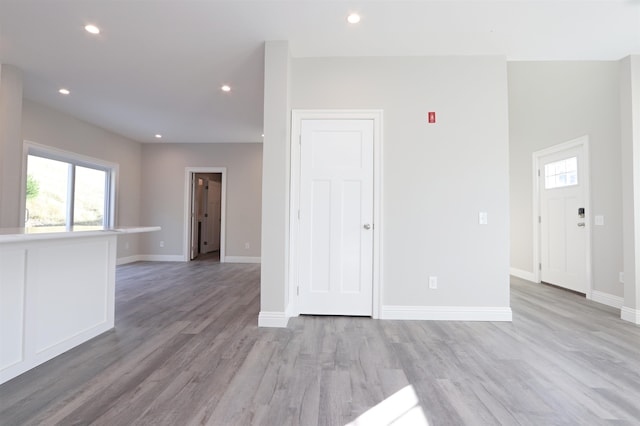 empty room with light hardwood / wood-style flooring