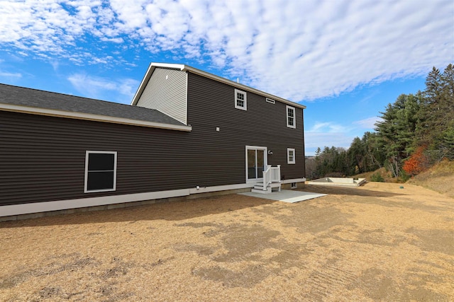 back of house with a patio