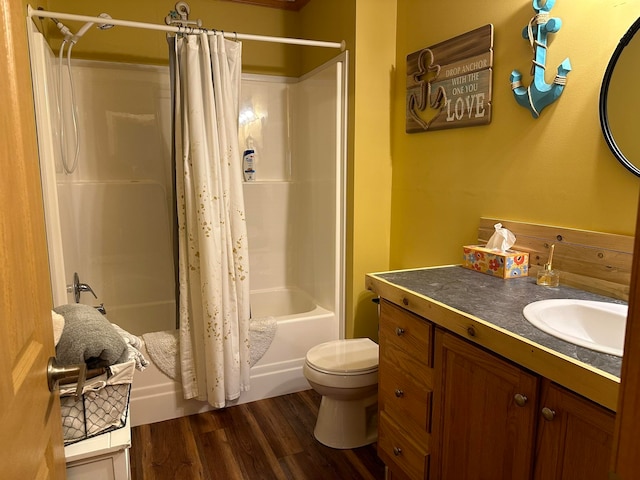 full bathroom featuring vanity, shower / tub combo, wood-type flooring, and toilet