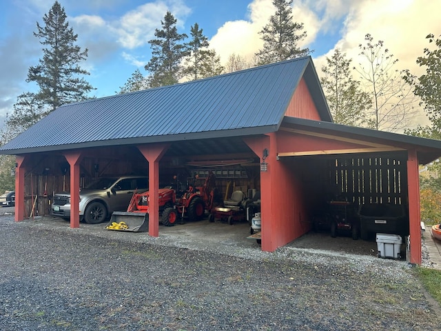 parking at dusk featuring a carport