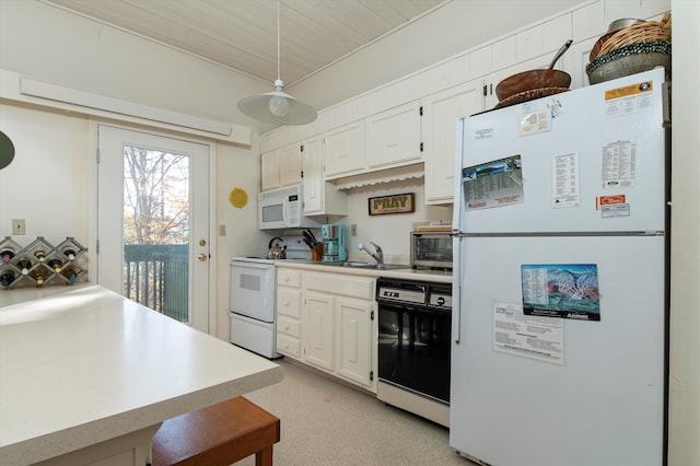 kitchen featuring wood ceiling, a kitchen breakfast bar, pendant lighting, sink, and white appliances