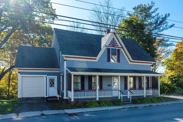 view of front of house featuring covered porch and a garage