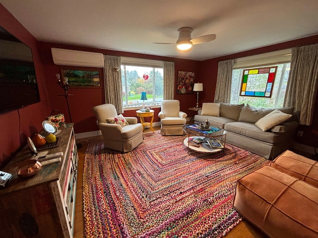 living room featuring ceiling fan and a wall mounted AC