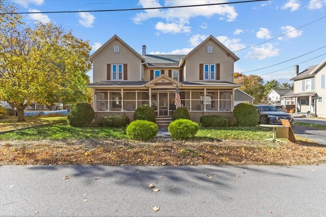 view of front of property with a sunroom