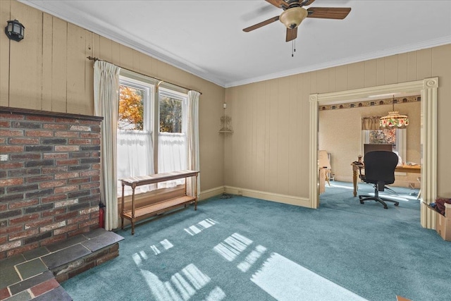 interior space with ceiling fan, ornamental molding, wooden walls, and dark carpet