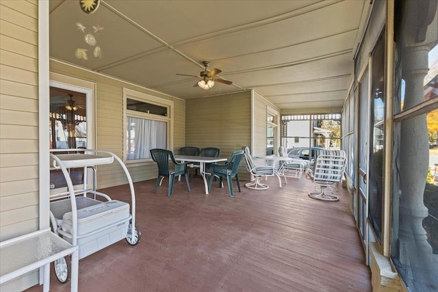 sunroom / solarium featuring ceiling fan