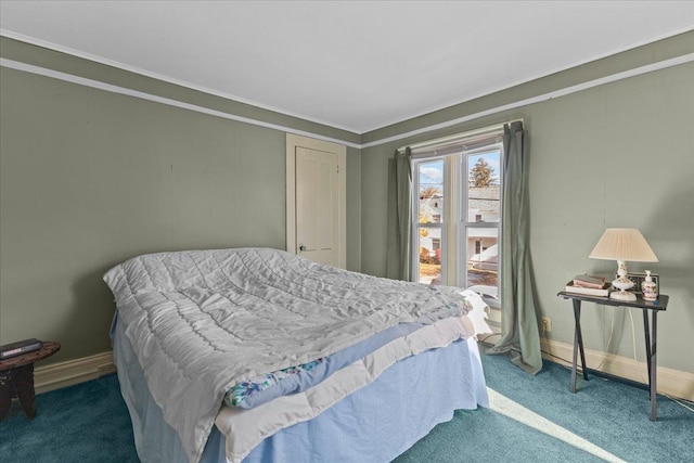 carpeted bedroom featuring crown molding