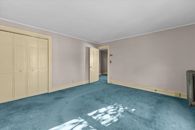 unfurnished bedroom featuring a closet, crown molding, and carpet floors