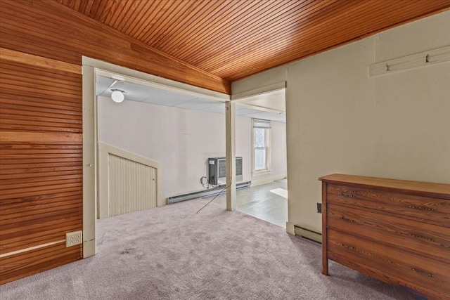 interior space with baseboard heating, an AC wall unit, wooden ceiling, carpet floors, and wood walls