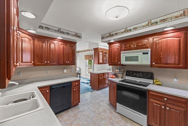 kitchen featuring sink and white appliances