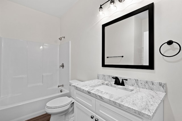 full bathroom with toilet, shower / washtub combination, hardwood / wood-style floors, and vanity