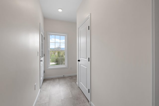 hallway with light tile patterned flooring