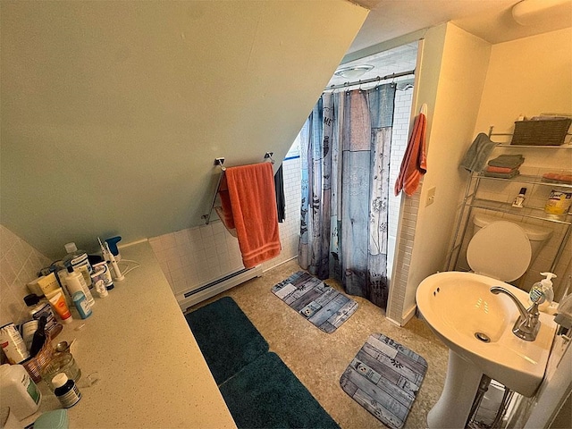 bathroom with a baseboard heating unit and a shower with shower curtain