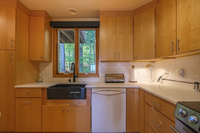 kitchen featuring white dishwasher, range with electric cooktop, backsplash, and sink