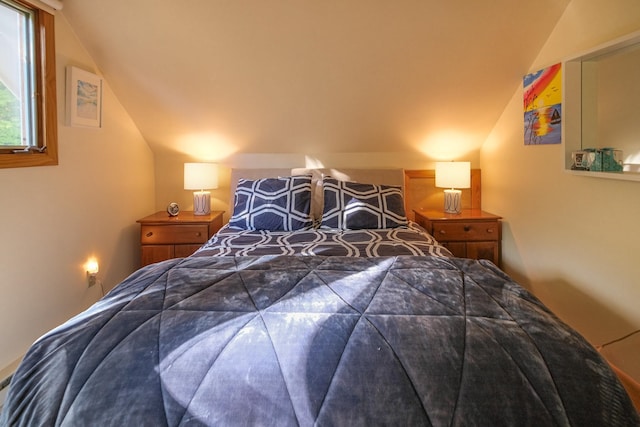 bedroom featuring vaulted ceiling