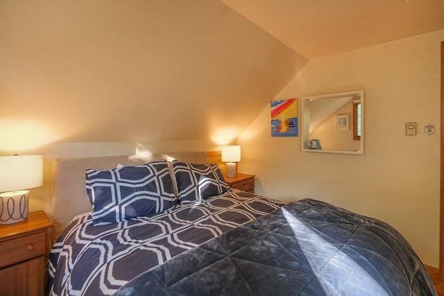 bedroom featuring vaulted ceiling