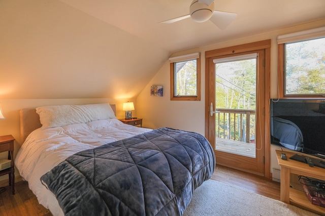 bedroom with hardwood / wood-style floors, ceiling fan, and lofted ceiling