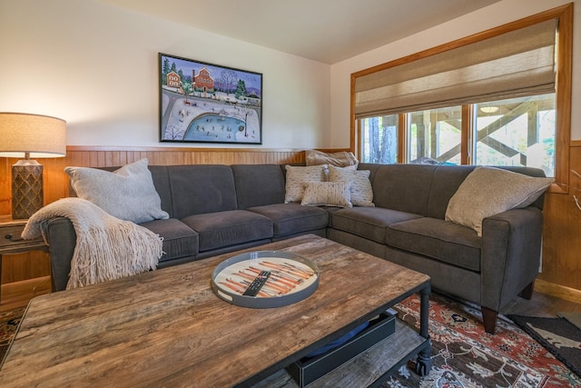 living room featuring wood walls