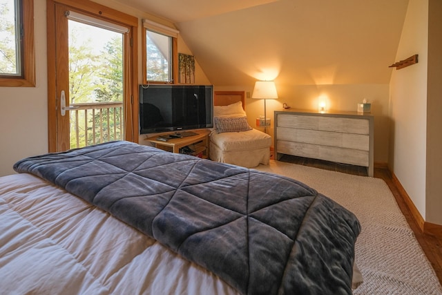 bedroom with carpet and vaulted ceiling