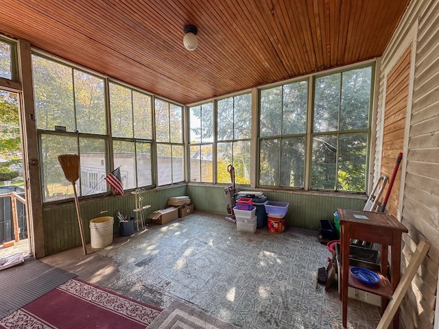 unfurnished sunroom featuring wooden ceiling