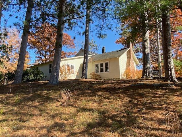 44 Pleasant View Rd, Bradford, NH 03221 - back of property featuring a chimney