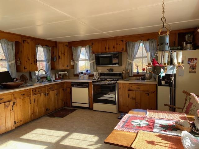 44 Pleasant View Rd, Bradford, NH 03221 - kitchen with white appliances, light countertops, and plenty of natural light