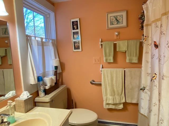 44 Pleasant View Rd, Bradford, NH 03221 - full bathroom featuring baseboard heating, vanity, and curtained shower