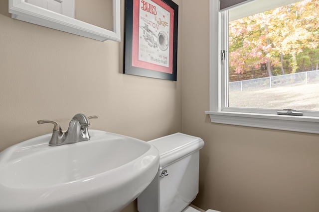 bathroom with toilet and sink