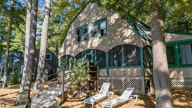 back of house with a sunroom