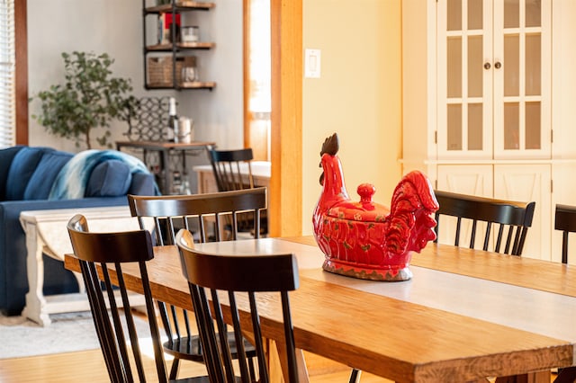 dining space featuring wood-type flooring