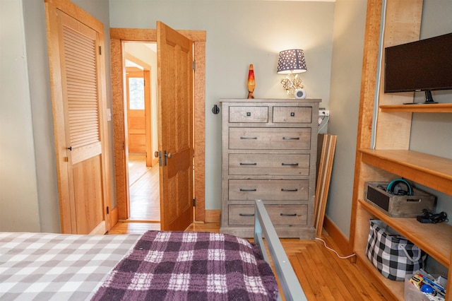 bedroom featuring a closet and light hardwood / wood-style floors