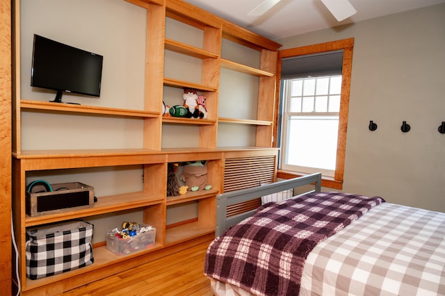 bedroom featuring wood-type flooring and ceiling fan