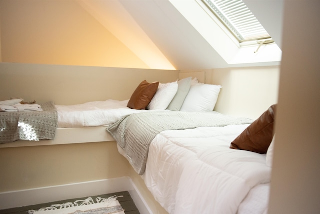 bedroom featuring lofted ceiling