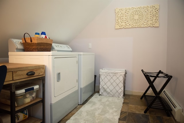 clothes washing area featuring a baseboard heating unit and washing machine and clothes dryer