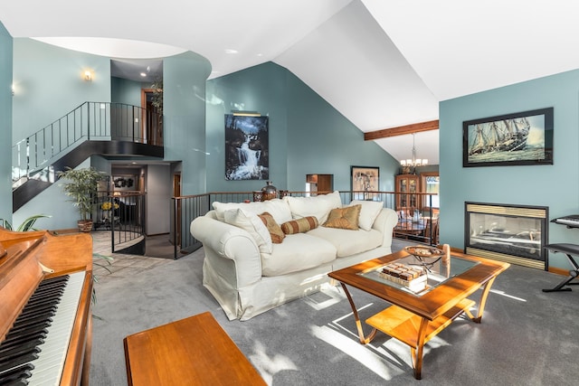 carpeted living room featuring high vaulted ceiling and an inviting chandelier