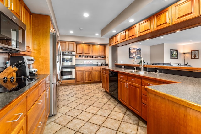 kitchen with light tile patterned flooring, sink, and black appliances