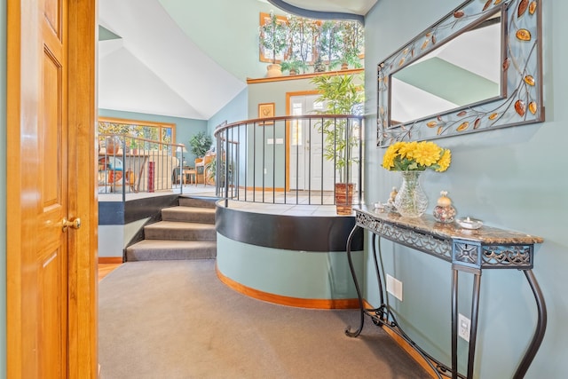 interior space with carpet floors and lofted ceiling