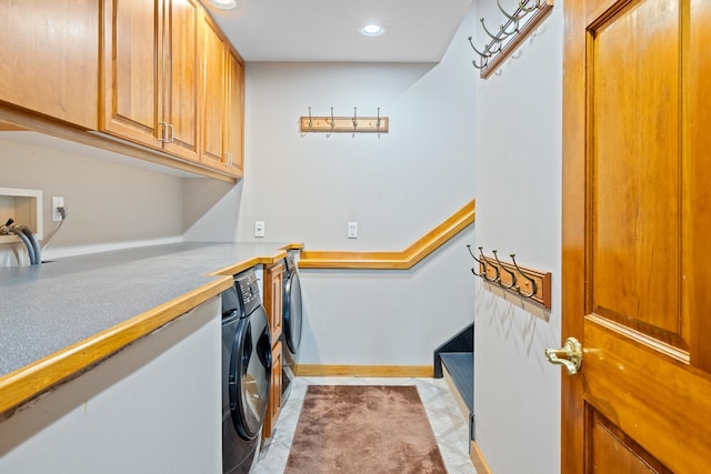 laundry room with cabinets and washing machine and dryer