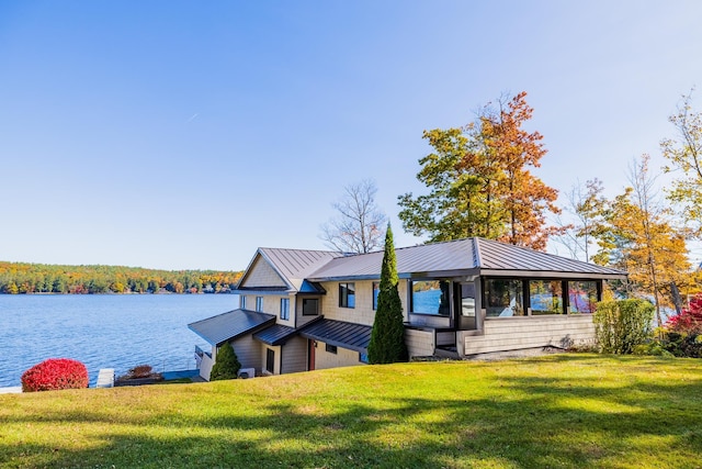 exterior space with a front yard and a water view