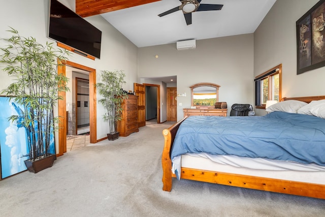 carpeted bedroom featuring ensuite bathroom, a wall unit AC, ceiling fan, high vaulted ceiling, and beamed ceiling