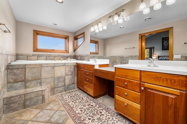 bathroom featuring vanity and tile walls