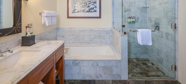 bathroom featuring vanity and plus walk in shower