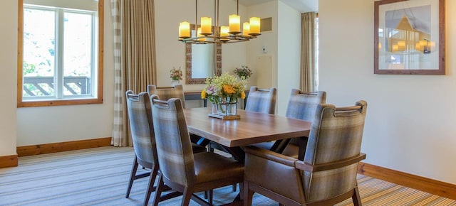 dining area with a notable chandelier and a healthy amount of sunlight