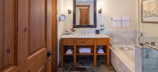 bathroom with vanity and independent shower and bath