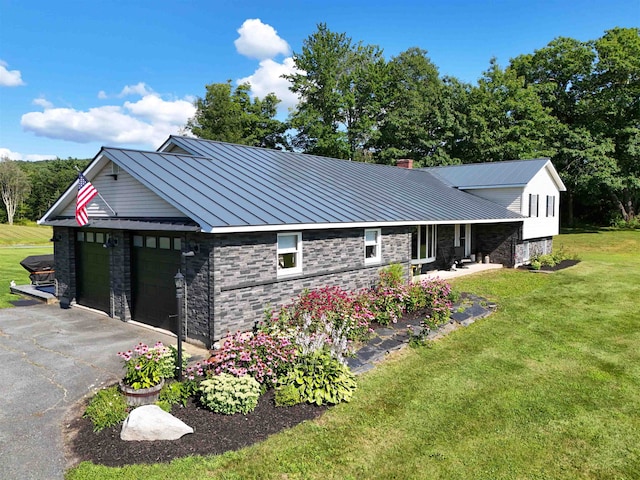 exterior space with a front lawn and a garage